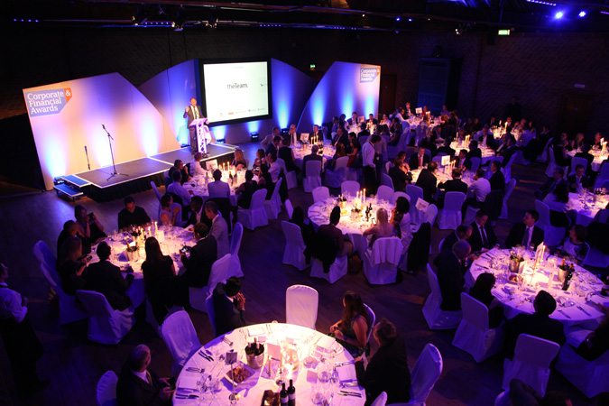 Picture from the UpDown gala award ceremony showing dinner tables and presenter's podium